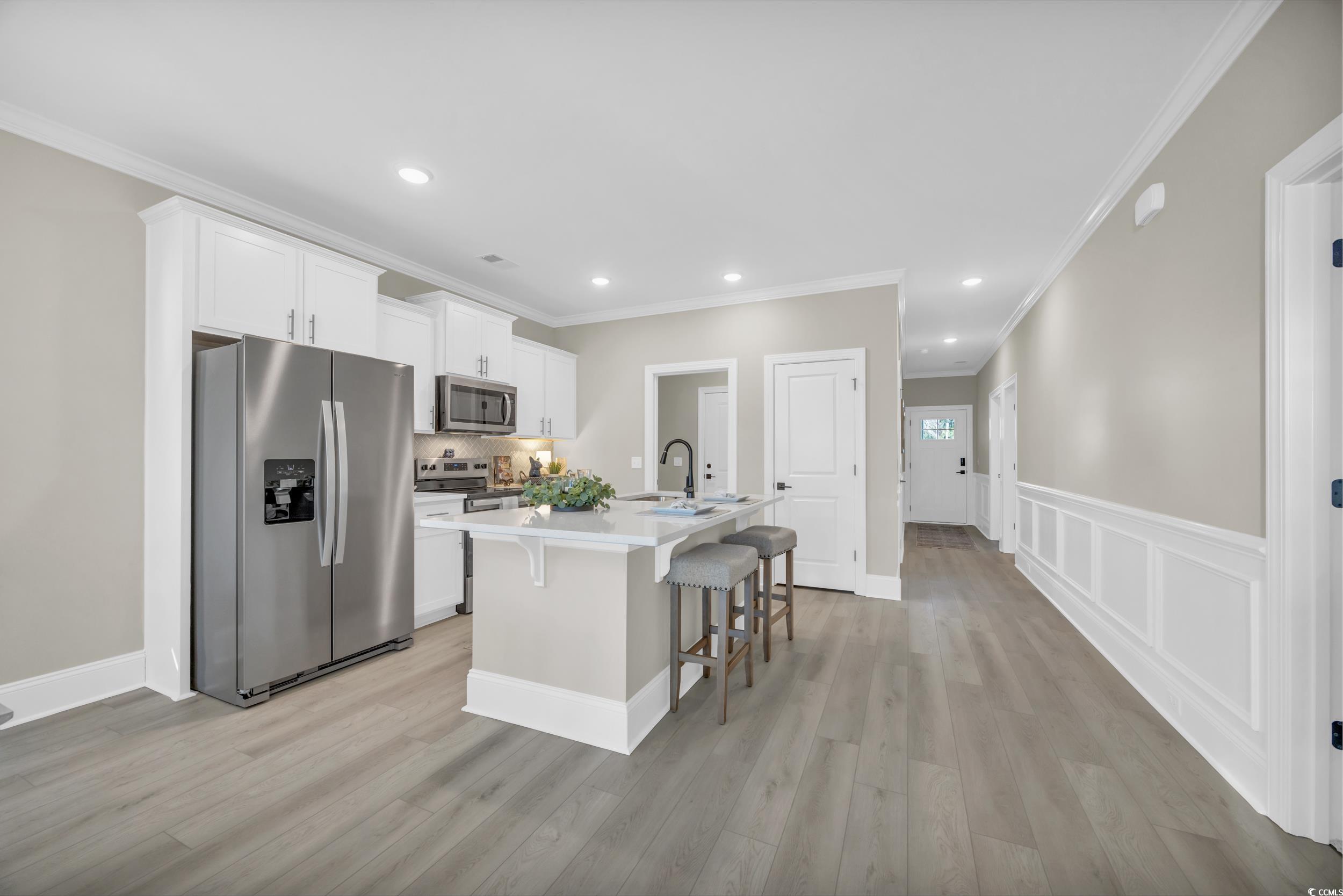 3123 Tiger Tail Road Conway, SC 29526 - Photo 14 of 38 Dining space with sink, ornamental molding, a chan