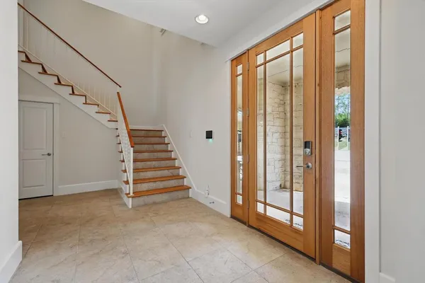 a view of entryway with stairs