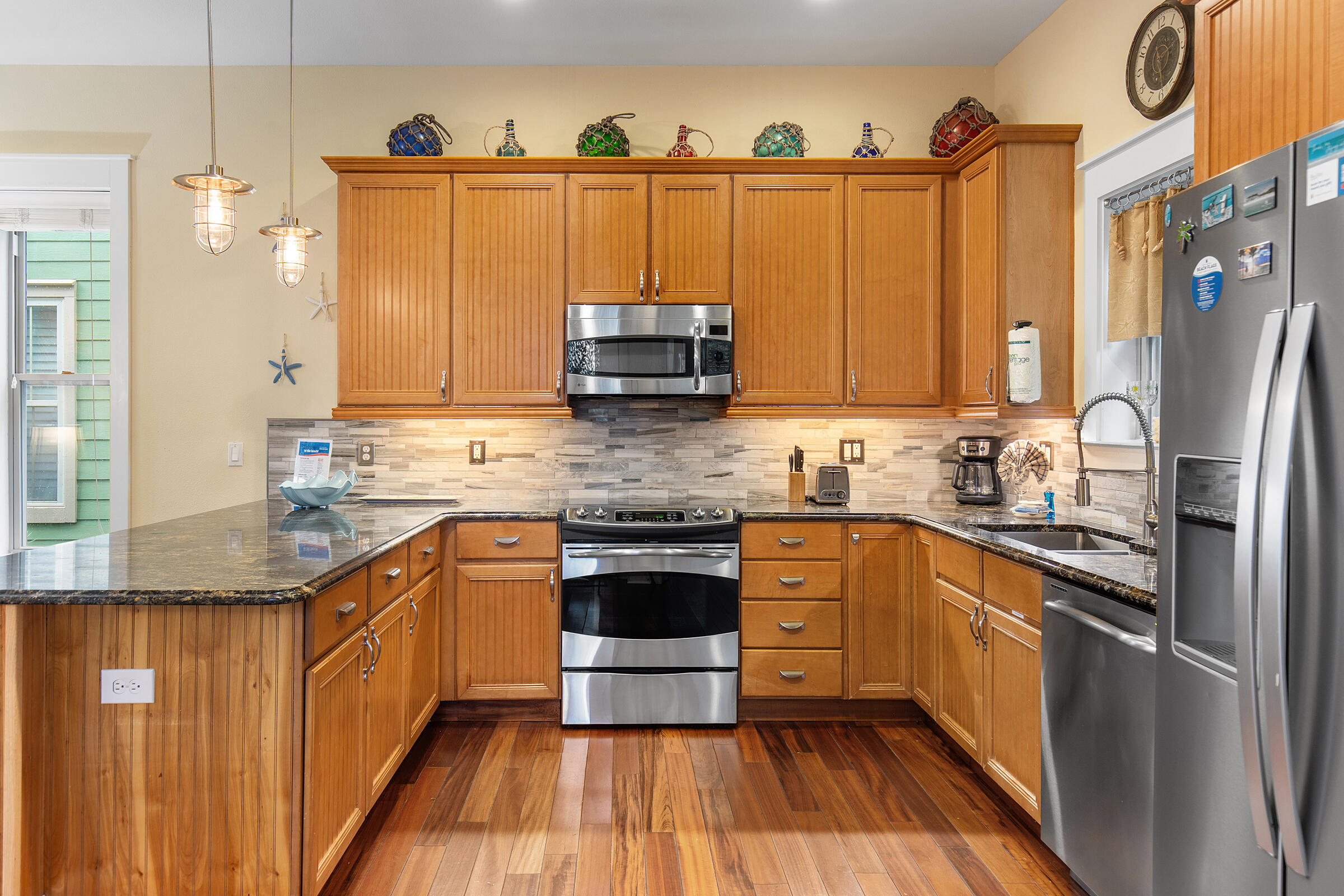 44 Asher Way Santa Rosa Beach, FL 32459 - Photo 22 of 63 a kitchen with stainless steel appliances a refrigerator sink and cabinets