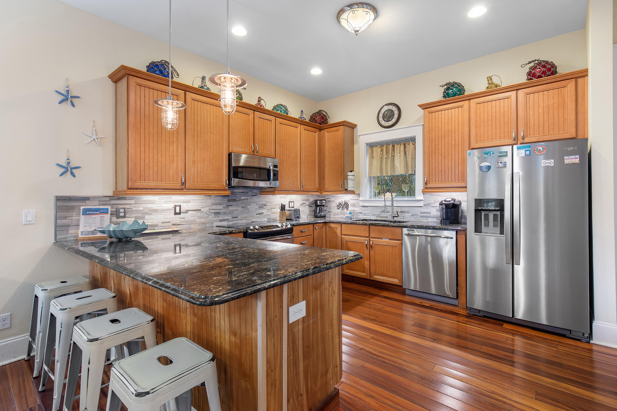 44 Asher Way Santa Rosa Beach, FL 32459 - Photo 24 of 63 a kitchen with stainless steel appliances granite countertop a sink stove and refrigerator