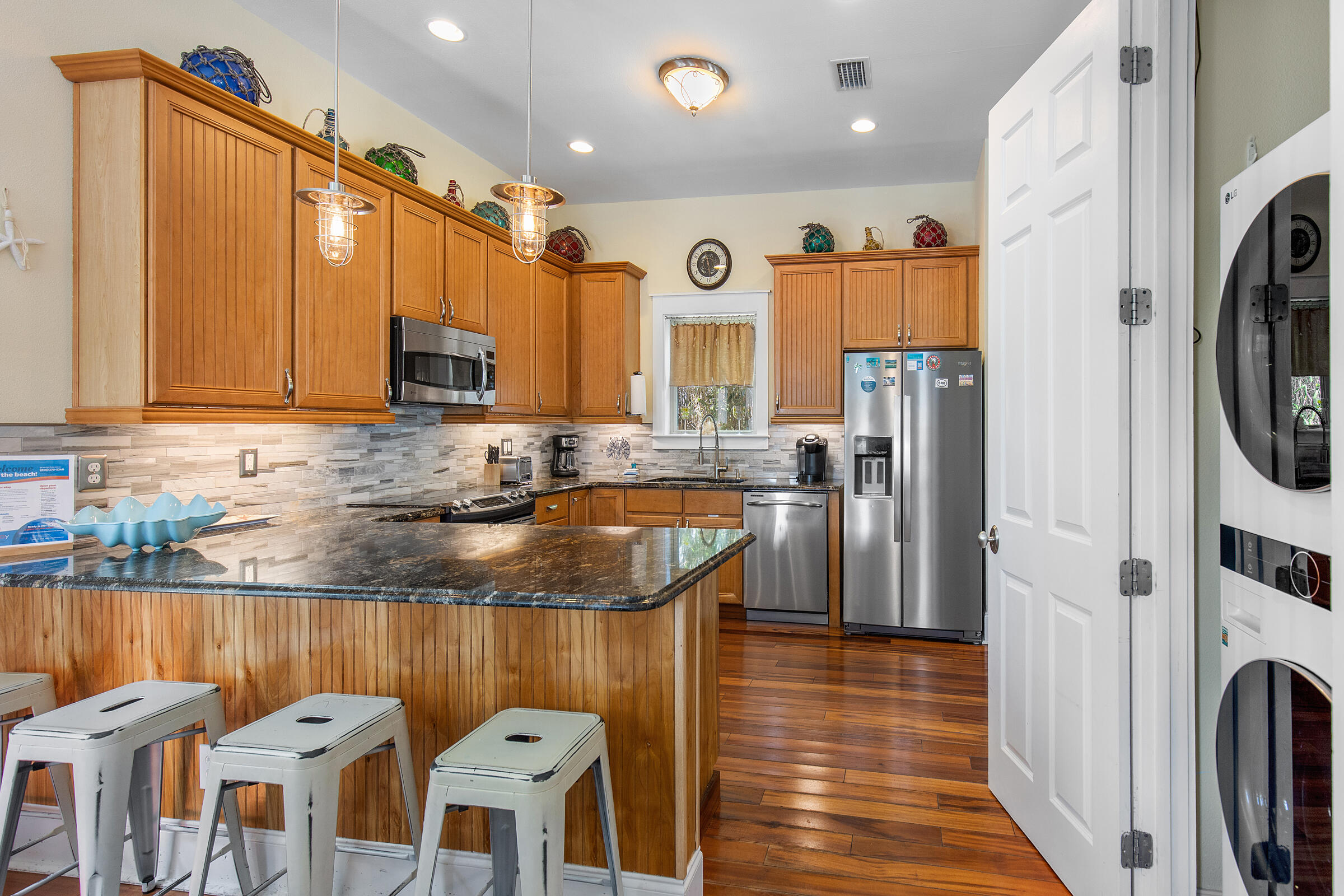 44 Asher Way Santa Rosa Beach, FL 32459 - Photo 59 of 63 a kitchen with stainless steel appliances granite countertop a refrigerator a stove top oven a sink and dishwasher