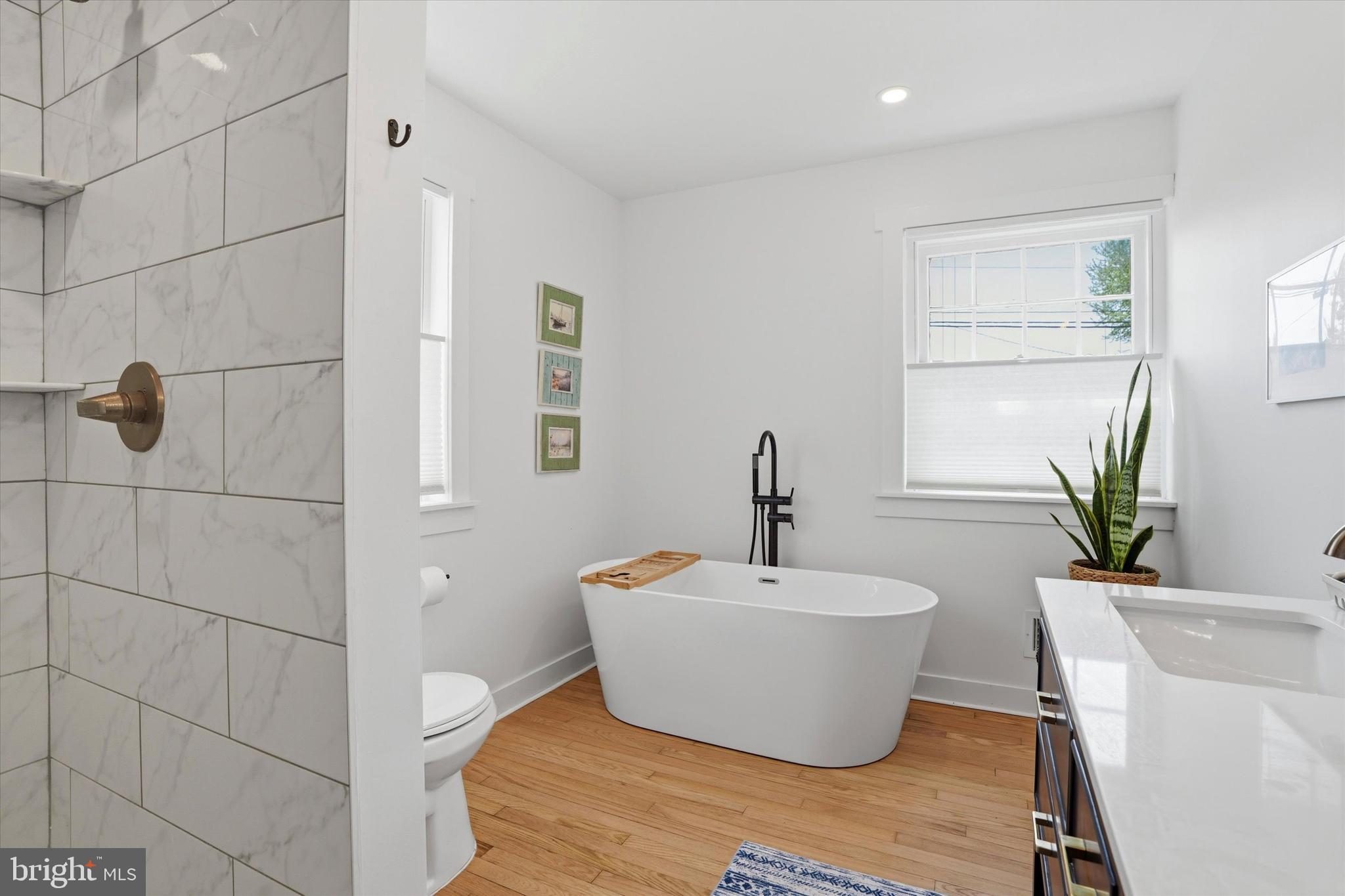 206 Gumbes Road Collegeville, PA 19426 - Photo 19 of 32 a white tub sitting next to a white toilet