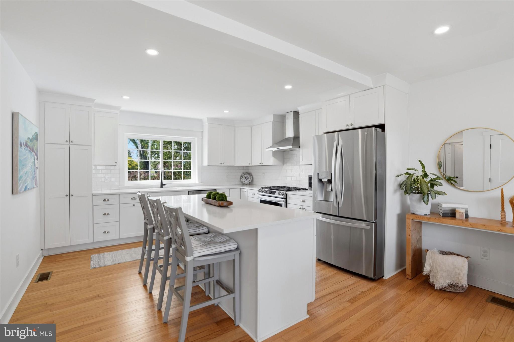 206 Gumbes Road Collegeville, PA 19426 - Photo 8 of 32 a kitchen with stainless steel appliances a refrigerator a stove a dining table and chairs