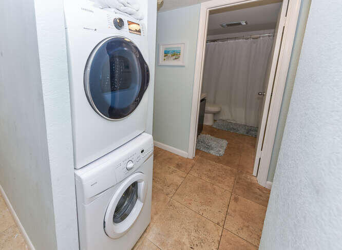 420 Celestial Way, Unit 101 Juno Beach, FL 33408 - Photo 26 of 37 a view of a hallway with washer and dryer