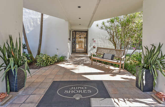 420 Celestial Way, Unit 101 Juno Beach, FL 33408 - Photo 10 of 37 a bathroom with a granite countertop sink and a mirror