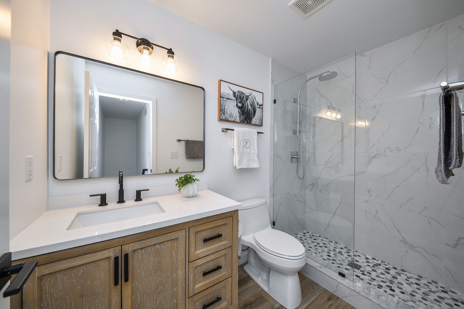 39W232 Armstrong Lane Geneva, IL 60134 - Photo 17 of 20 a bathroom with a sink a toilet and shower