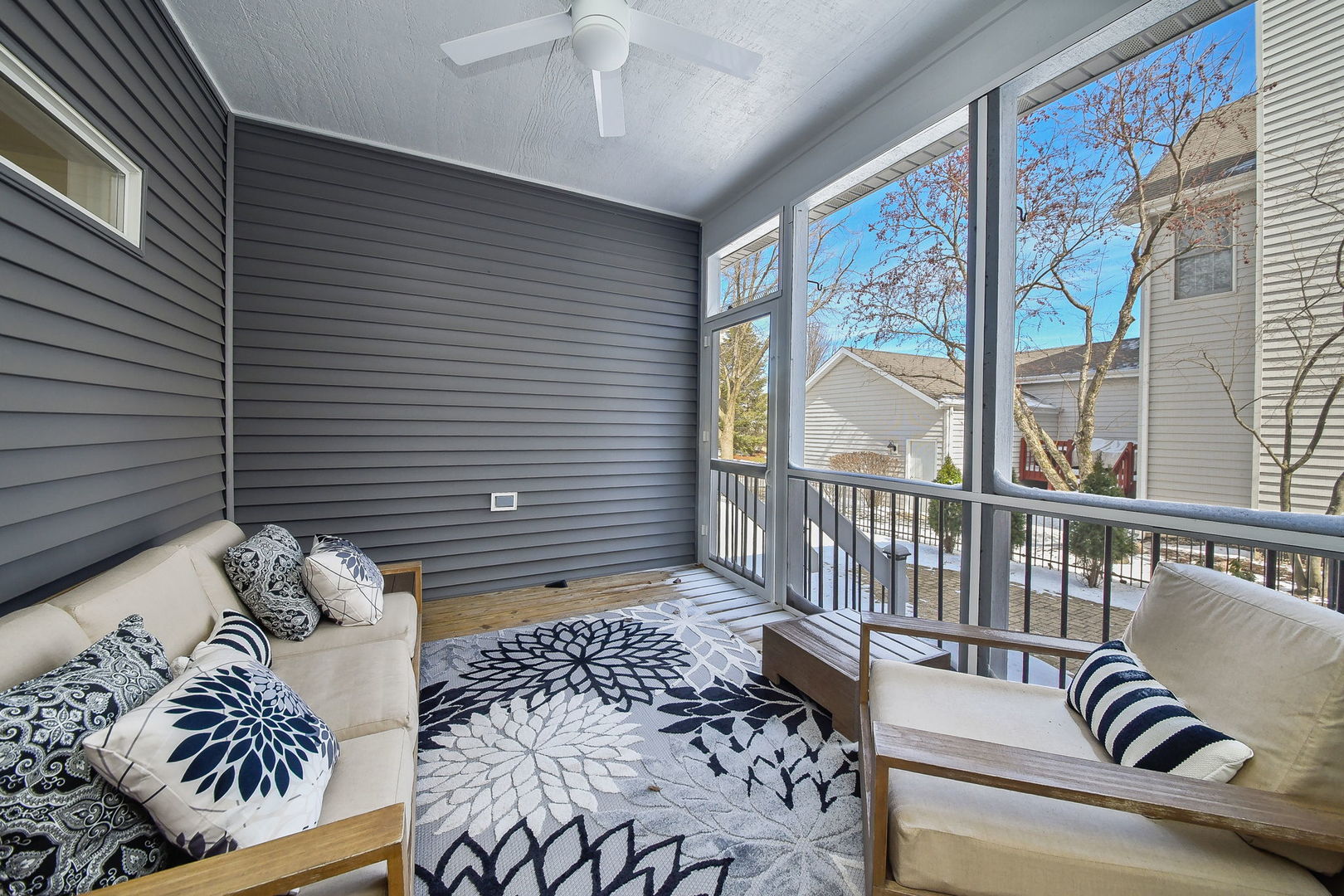39W232 Armstrong Lane Geneva, IL 60134 - Photo 18 of 20 a balcony with furniture and a large window