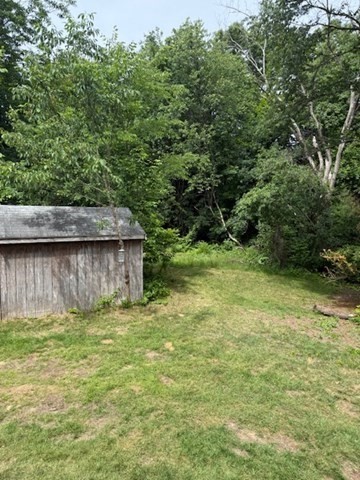 113 West Main Street, Unit 113 Ayer, MA 01432 - Photo 13 of 17 a backyard of a house with lots of green space