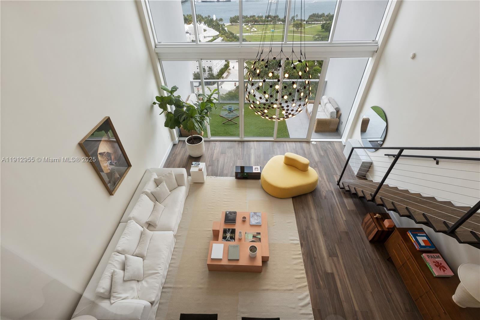 1040 Biscayne Boulevard, Unit 1602 Miami, FL 33132 - Photo 14 of 39 a picture of a living room with furniture and a window