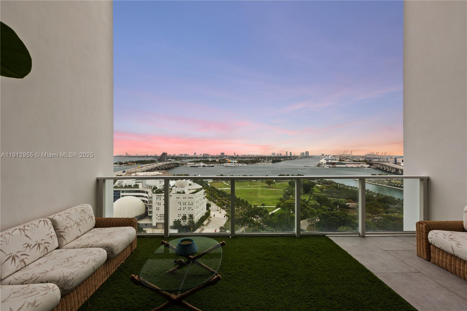 1040 Biscayne Boulevard, Unit 1602 Miami, FL 33132 - Photo 30 of 39 a view of a balcony with lake view and a floor to ceiling window