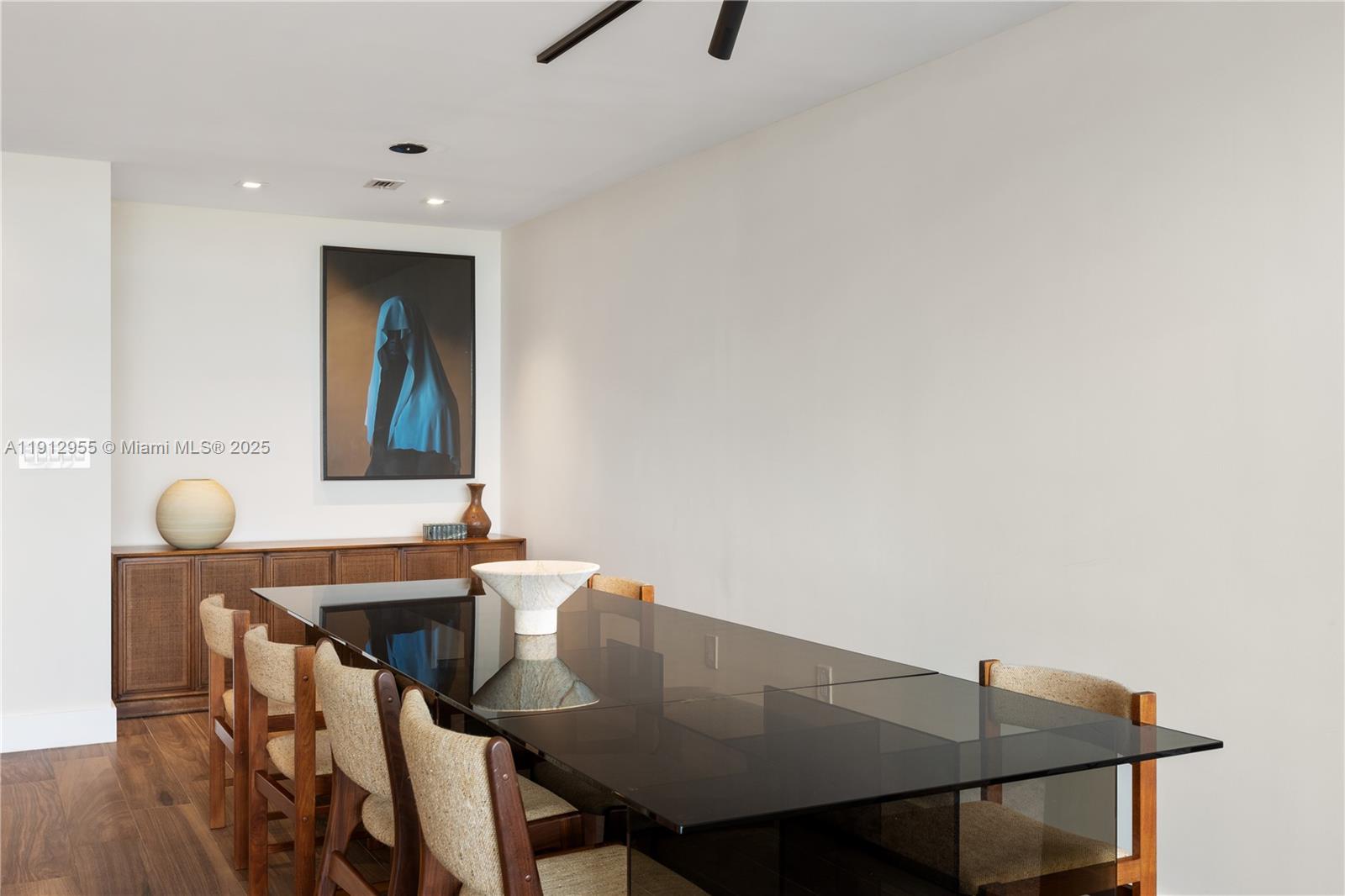 1040 Biscayne Boulevard, Unit 1602 Miami, FL 33132 - Photo 7 of 39 a view of a dining room with furniture and wooden floor