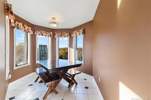 a view of a room with furniture and window