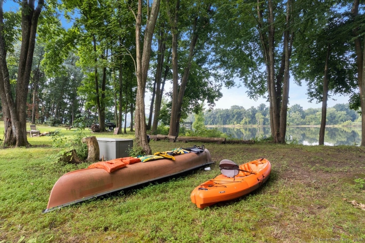 195 Injun Hollow Road Haddam, CT 06424 - Photo 39 of 40 a backyard of a house with table and chairs