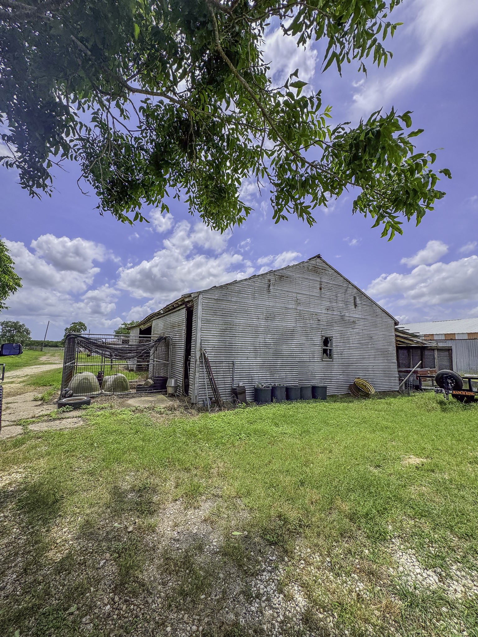 11810 Zamanek Road Needville, TX 77461 - Photo 19 of 30 a backyard of a house with table and chairs