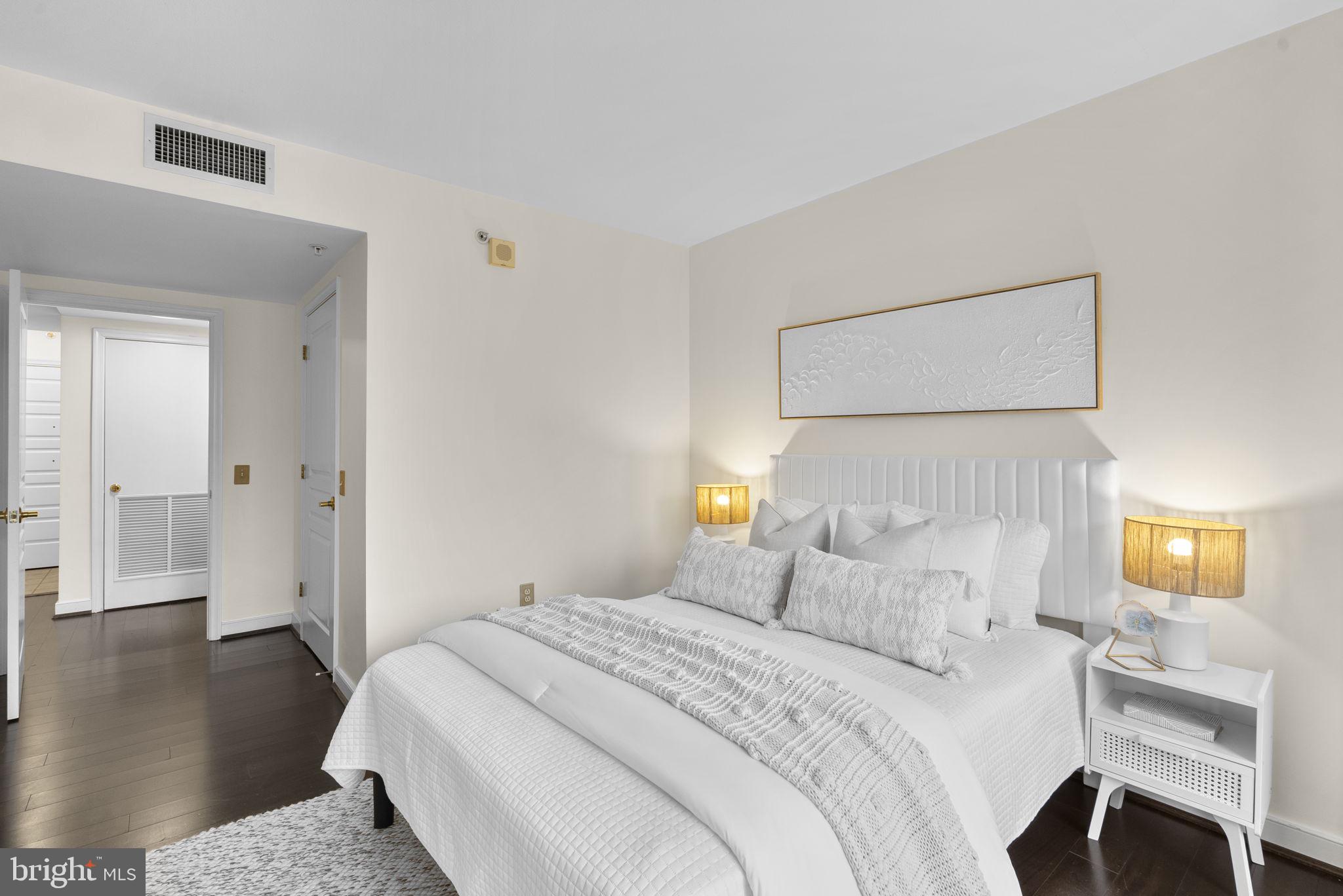 631 D Street Northwest, Unit 1129 Washington, DC 20004 - Photo 18 of 36 a bedroom with a bed and a night stand