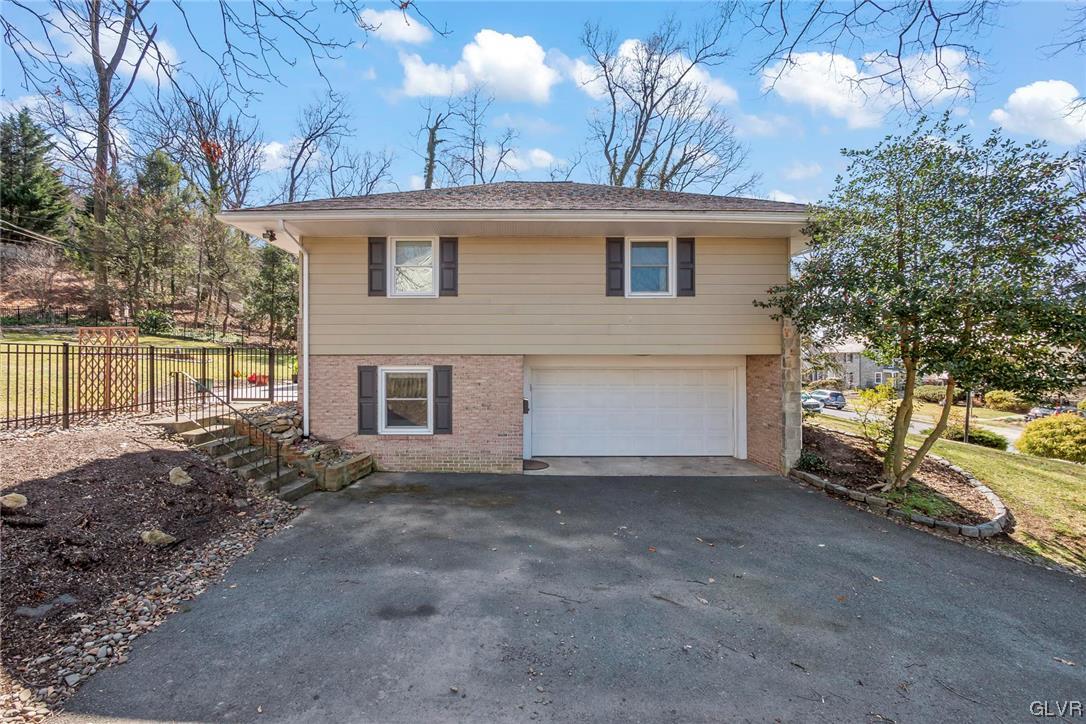 1511 Lorraine Road Reading, PA 19604 - Photo 23 of 27 Side view with garage and lower level entrance