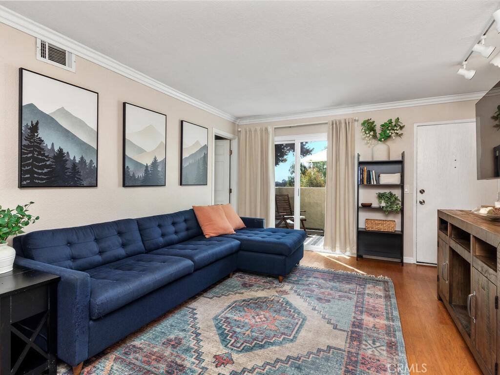6907 Quail Place, Unit F Carlsbad, CA 92009 - Photo 3 of 23 a living room with furniture and a fireplace