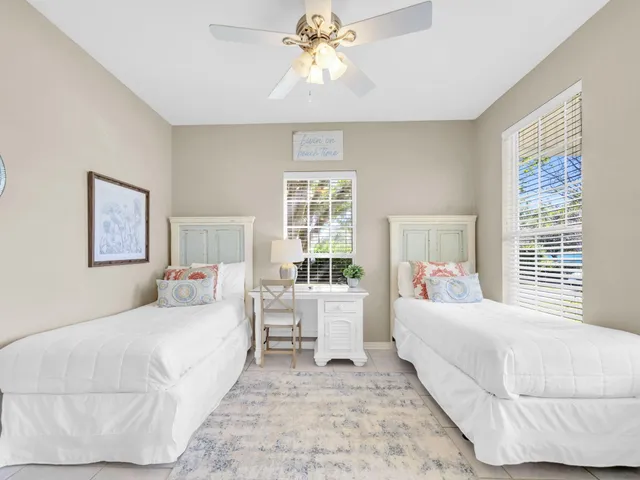 a view of a dining room kitchen island with furniture and a chandelier
