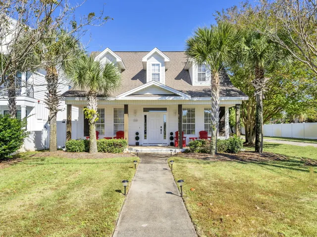 a front view of a house with outdoor seating space
