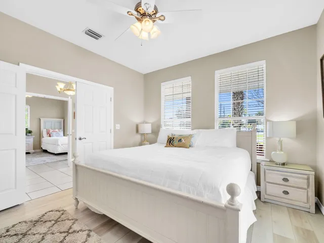 a bedroom with a bed and a table in it