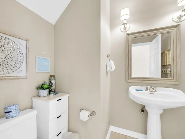 a bathroom with a bathtub a sink and a window