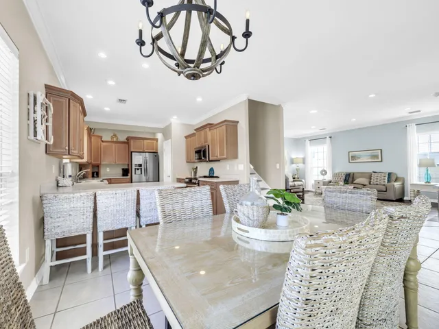 a bathroom with a sink a toilet and a large mirror