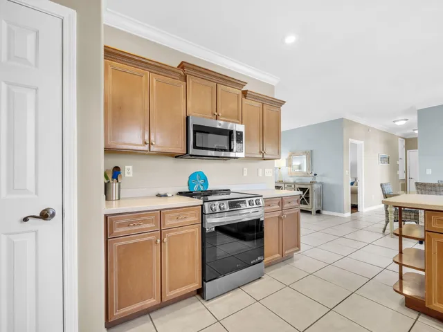 an aerial view of a house with garden space and street view