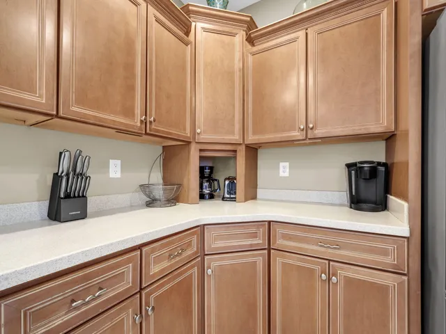 an aerial view of residential building with outdoor space and parking