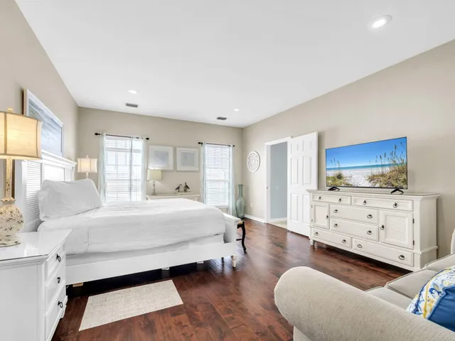 an aerial view of a house with a garden and a yard