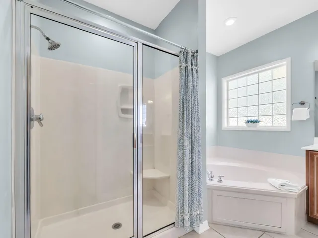 an aerial view of residential building with green space