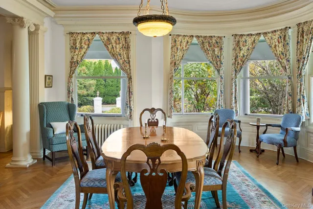 a view of a livingroom with furniture and a large window