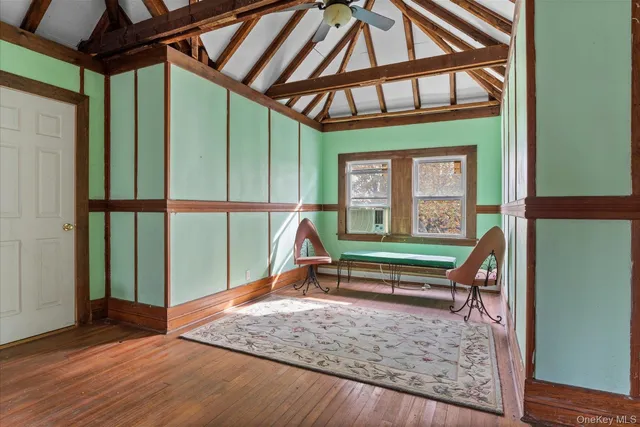 a bathroom with a granite countertop sink a toilet and a mirror