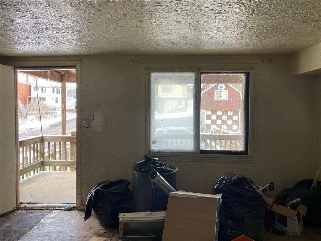 97 Frazier Avenue McKees Rocks, PA 15136 - Photo 4 of 13 a living room with furniture and a window