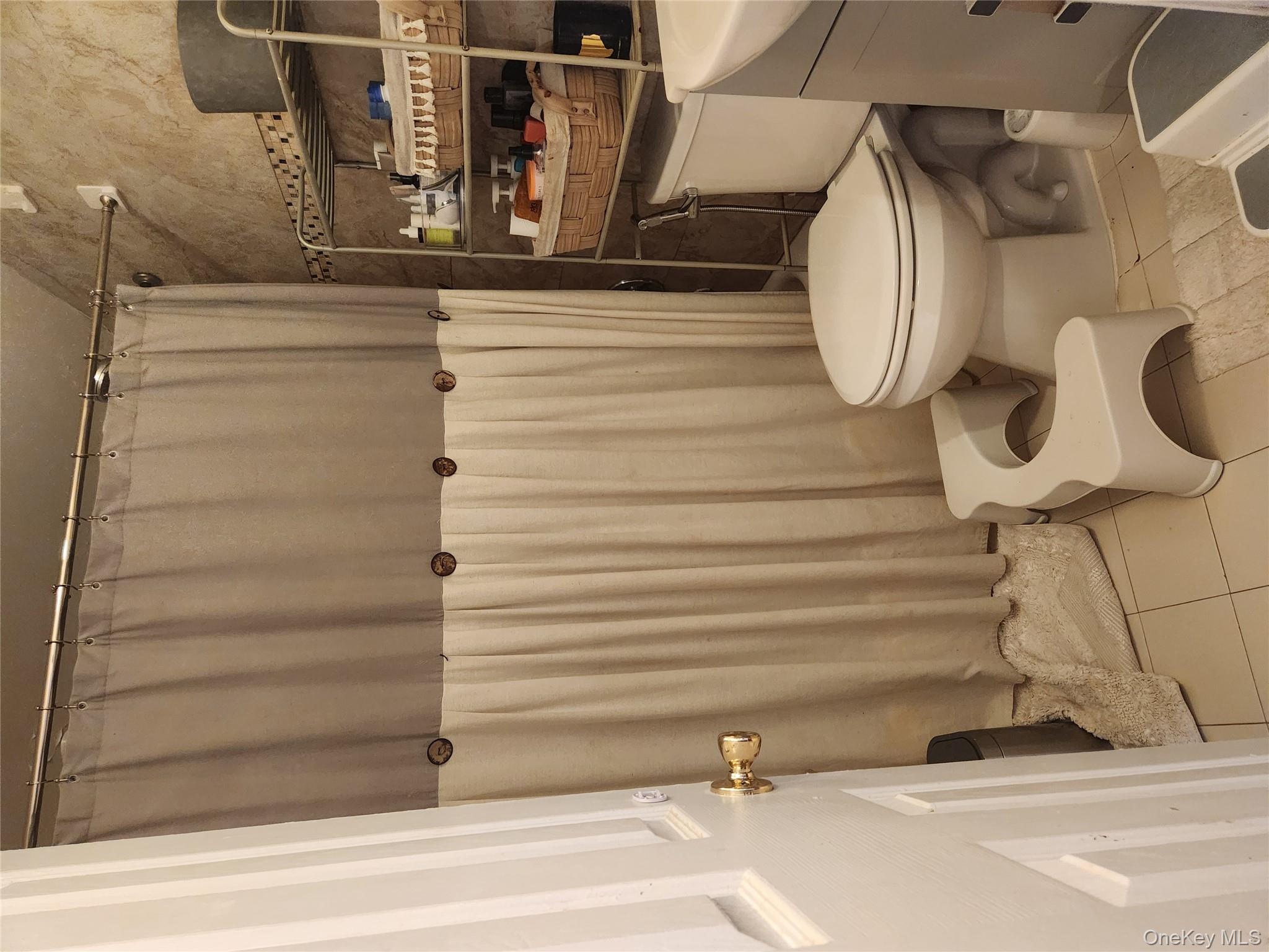 142-34 Bascom Avenue Queens, NY 11436 - Photo 7 of 21 Full bathroom with tile patterned flooring, vanity, and a shower with shower curtain