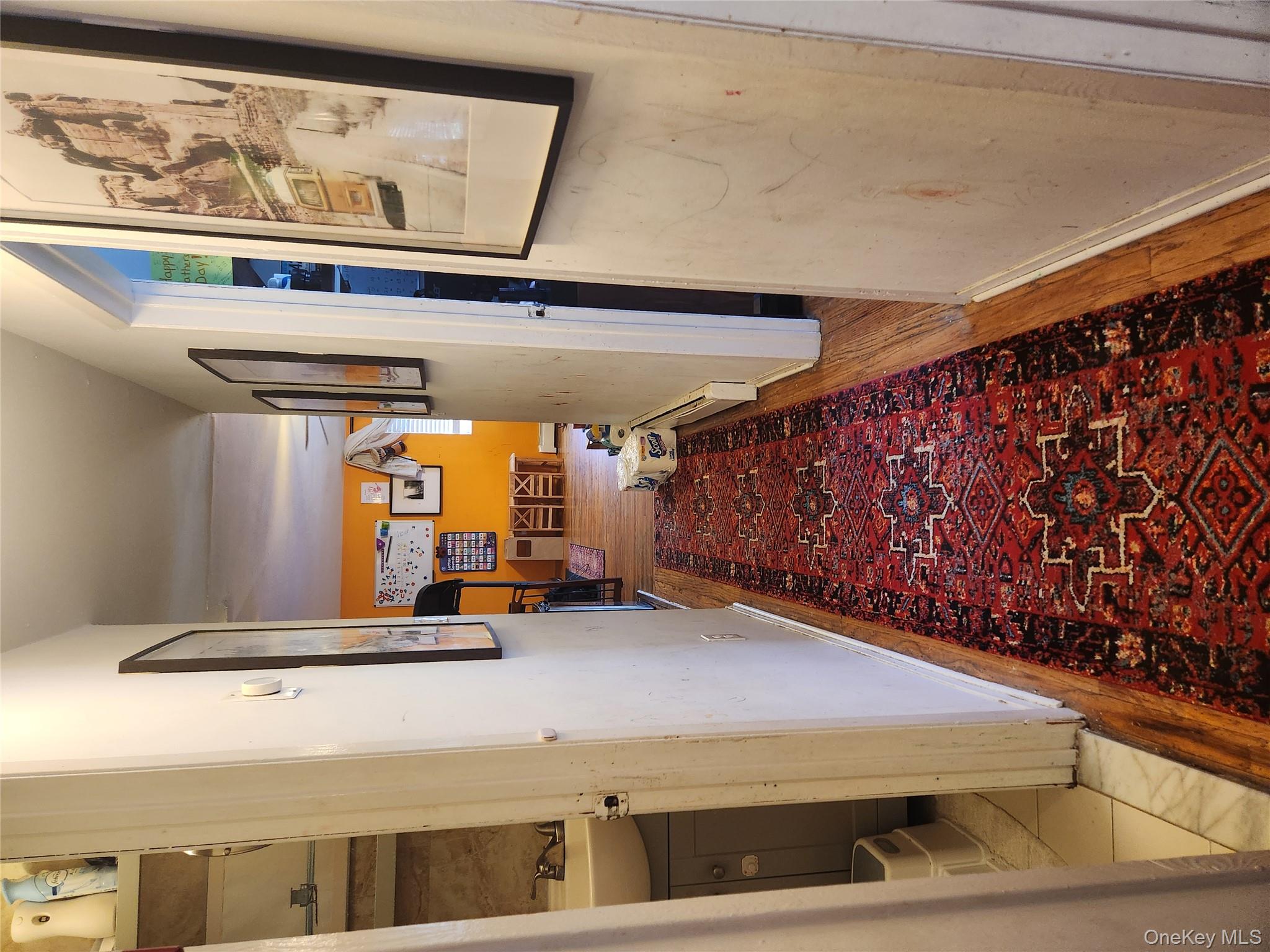 142-34 Bascom Avenue Queens, NY 11436 - Photo 8 of 21 Corridor with light wood-style floors and baseboards