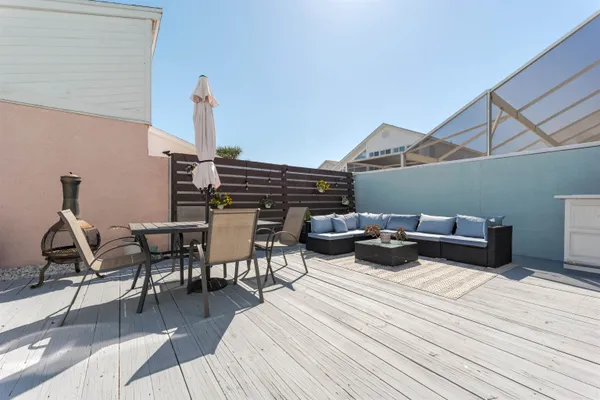 a roof deck view with a seating space