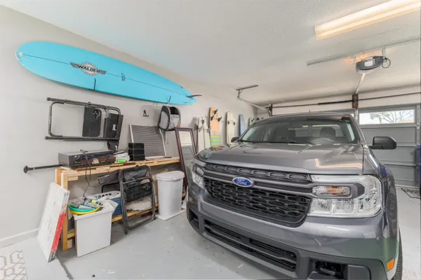 a view of kitchen with sink and appliances