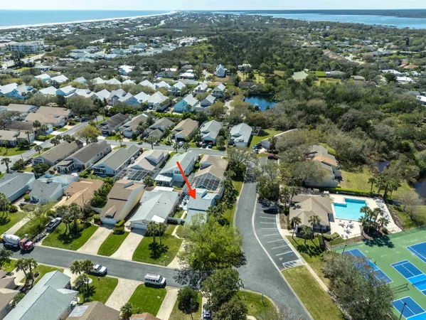 an aerial view of residential houses with outdoor space