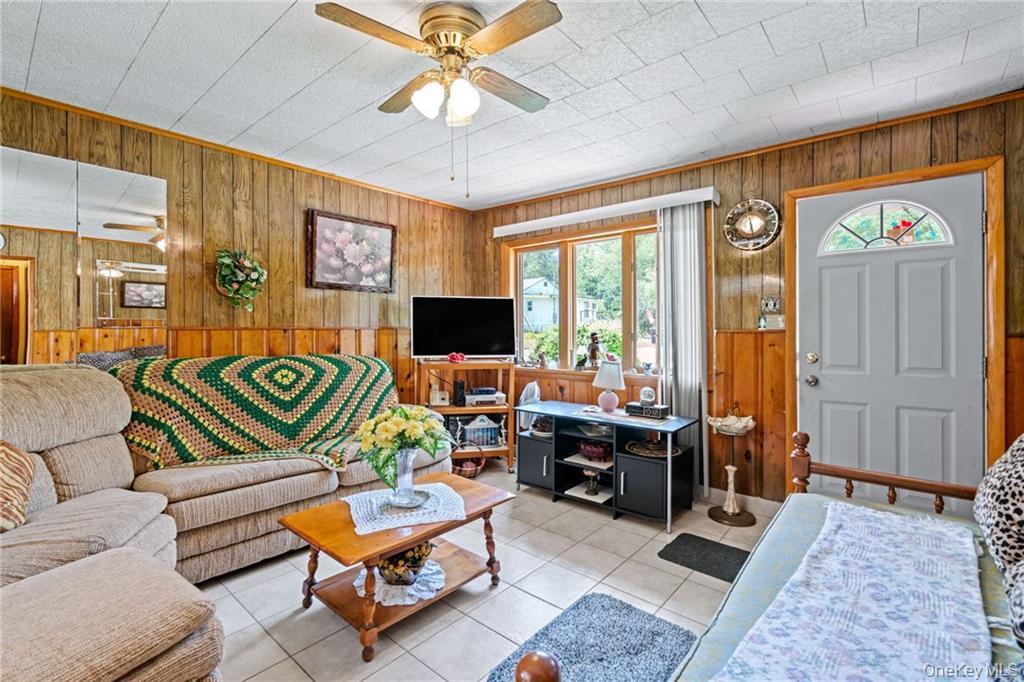 6 Leonard Road Monticello, NY 12701 - Photo 13 of 35 a living room with furniture and a flat screen tv