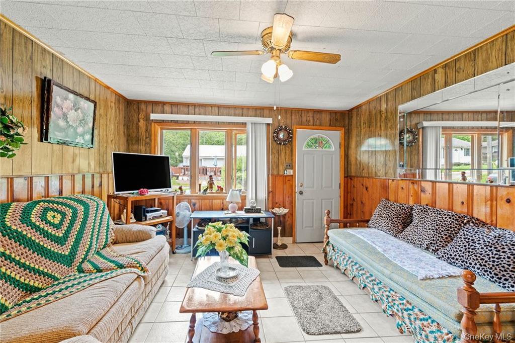 6 Leonard Road Monticello, NY 12701 - Photo 14 of 35 a living room with furniture and a flat screen tv