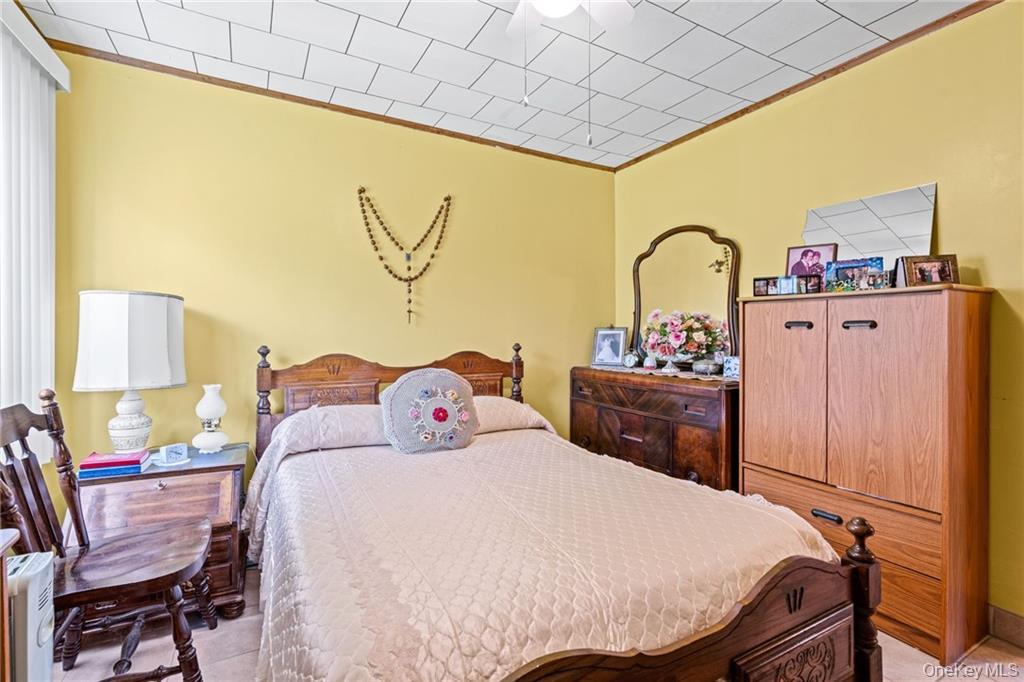 6 Leonard Road Monticello, NY 12701 - Photo 19 of 35 a bedroom with a bed and dresser with mirror