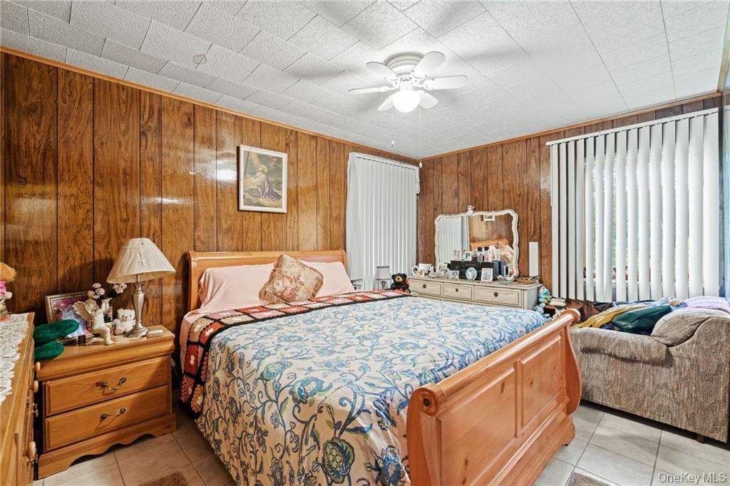 6 Leonard Road Monticello, NY 12701 - Photo 21 of 35 a bed sitting in a spacious bedroom next to a window