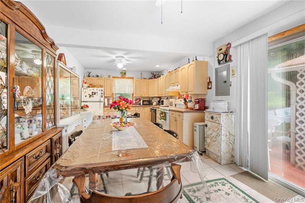 6 Leonard Road Monticello, NY 12701 - Photo 10 of 35 a room with stainless steel appliances kitchen island granite countertop a refrigerator a stove and white cabinets with wooden floor