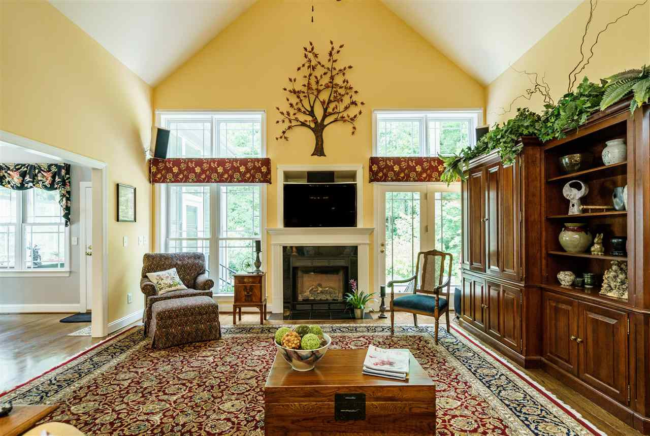8119 Dreamy Way Raleigh, NC 27613 - Photo 13 of 30 Custom mantle, television niche and ceiling fan. Surround sound and attractive lighting. Living Room