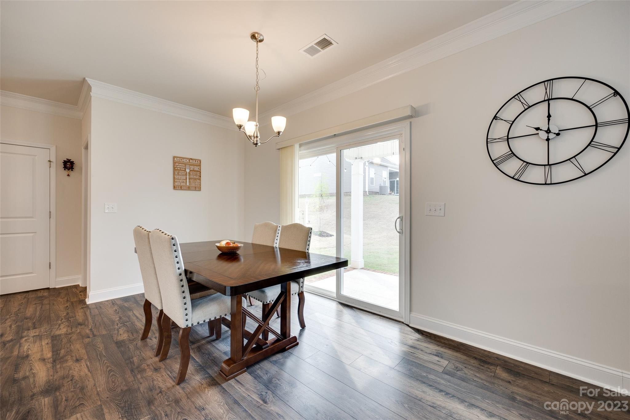 8013 Oakmere Road Waxhaw, NC 28173 - Photo 11 of 30 a view of a dining room with furniture window and wooden floor