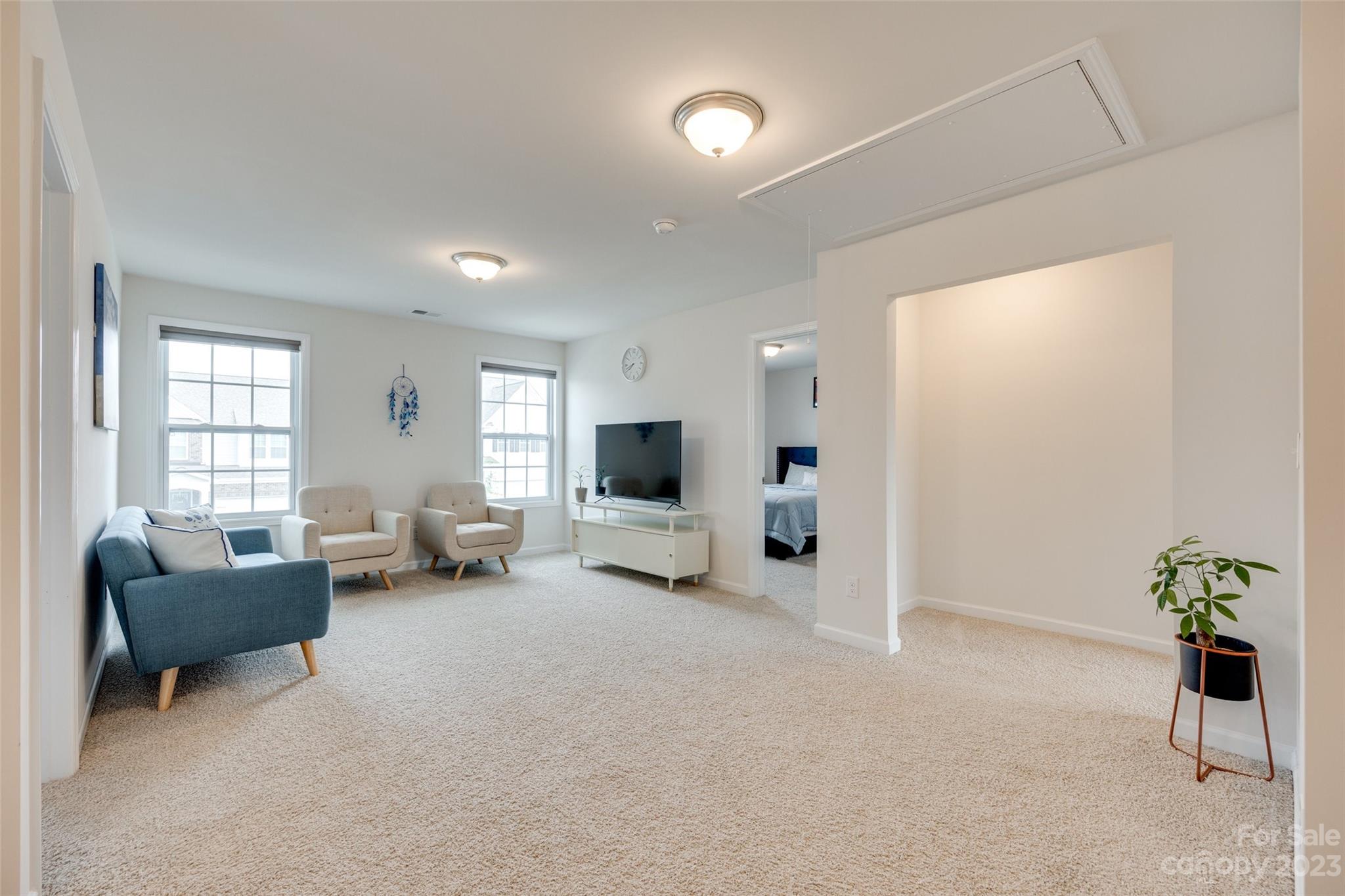 8013 Oakmere Road Waxhaw, NC 28173 - Photo 17 of 30 a living room with furniture and a flat screen tv
