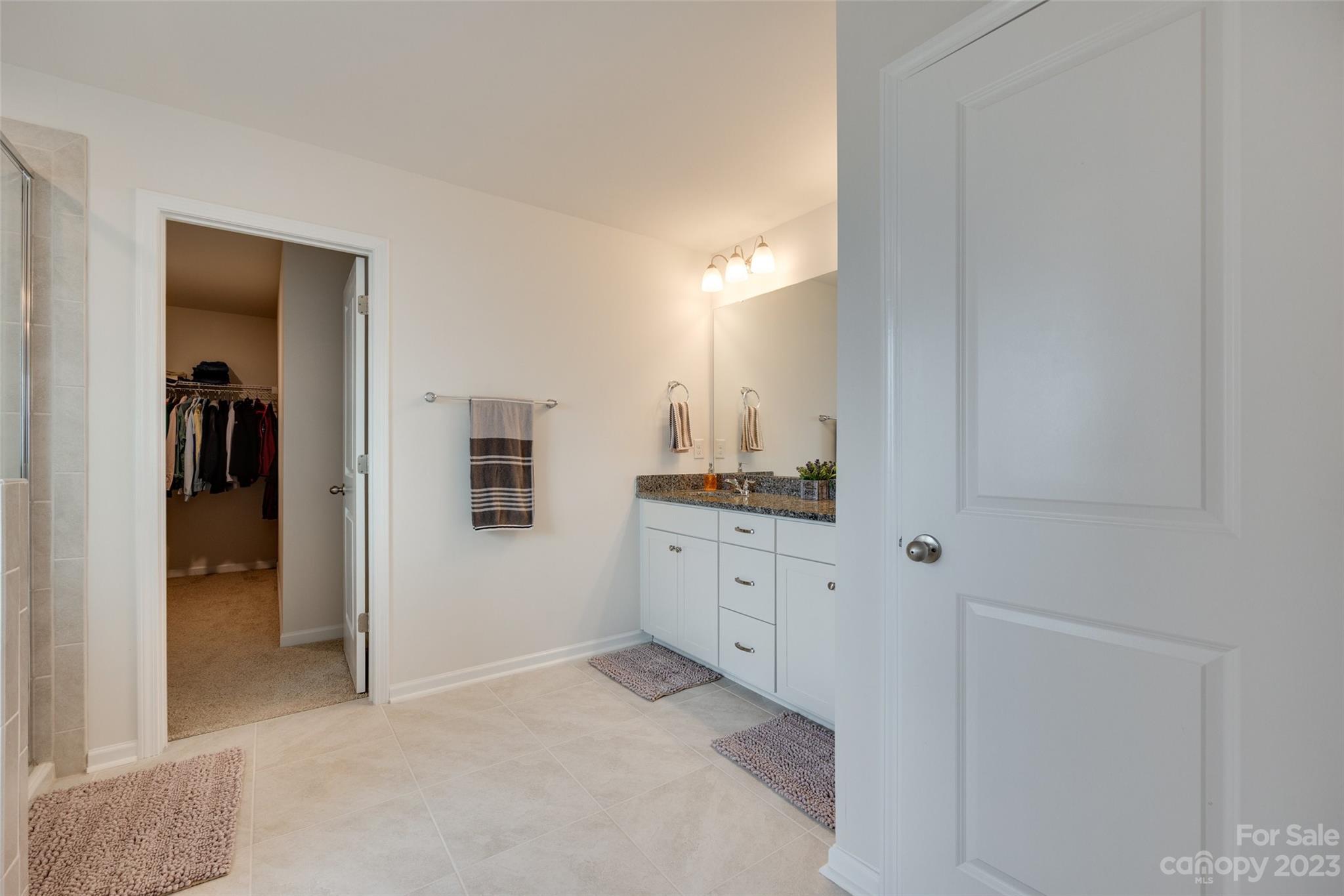 8013 Oakmere Road Waxhaw, NC 28173 - Photo 24 of 30 a room with a sink and a mirror
