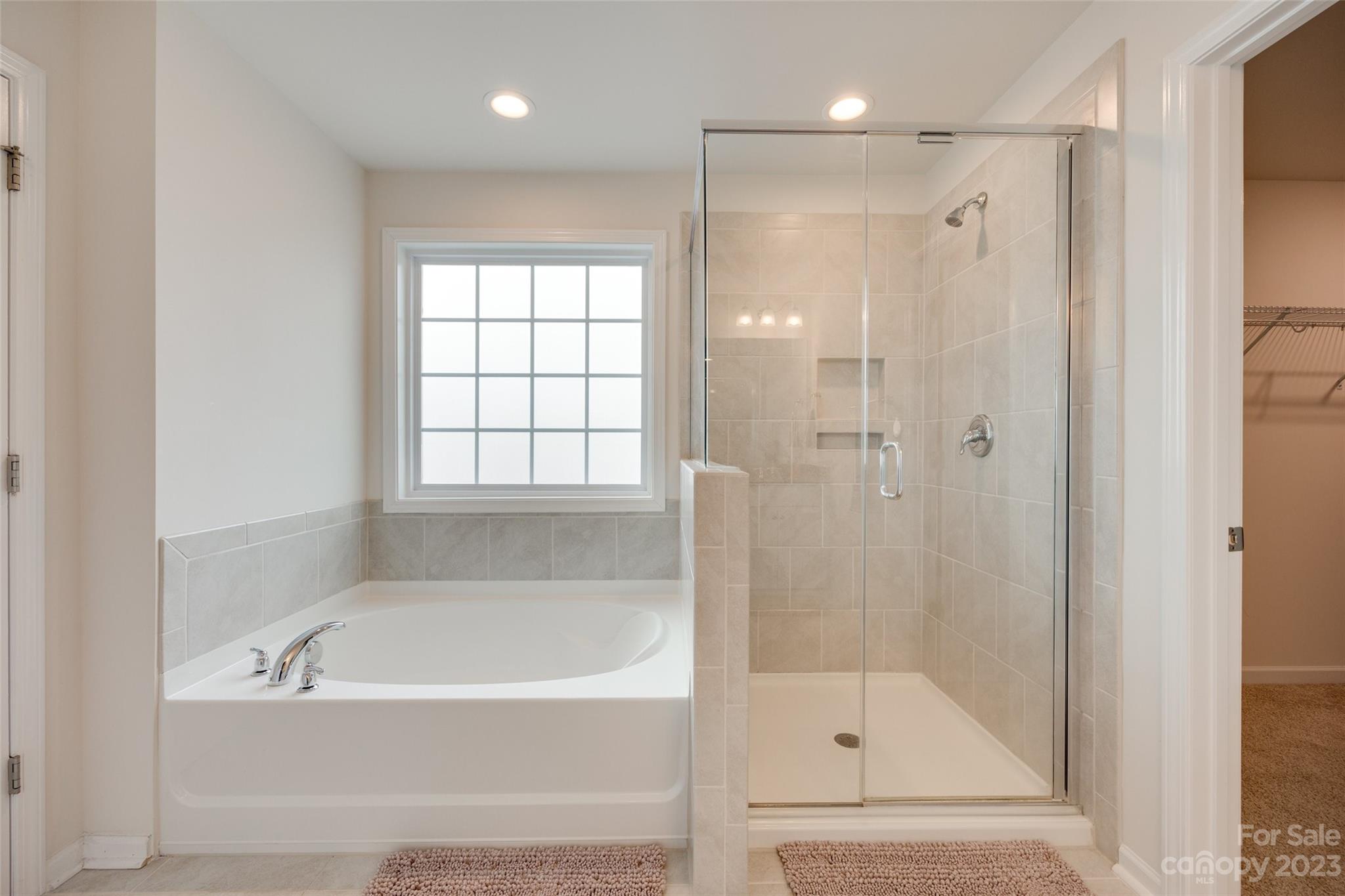 8013 Oakmere Road Waxhaw, NC 28173 - Photo 25 of 30 a bathroom with a bathtub and a shower