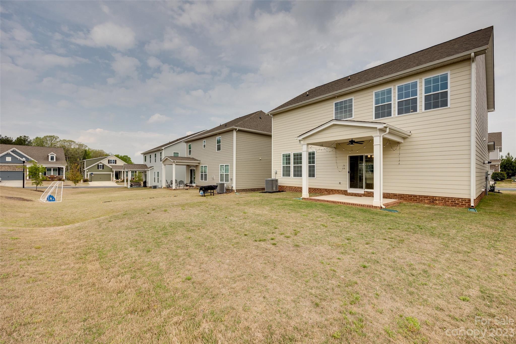 8013 Oakmere Road Waxhaw, NC 28173 - Photo 28 of 30 a view of a white house next to a yard with road