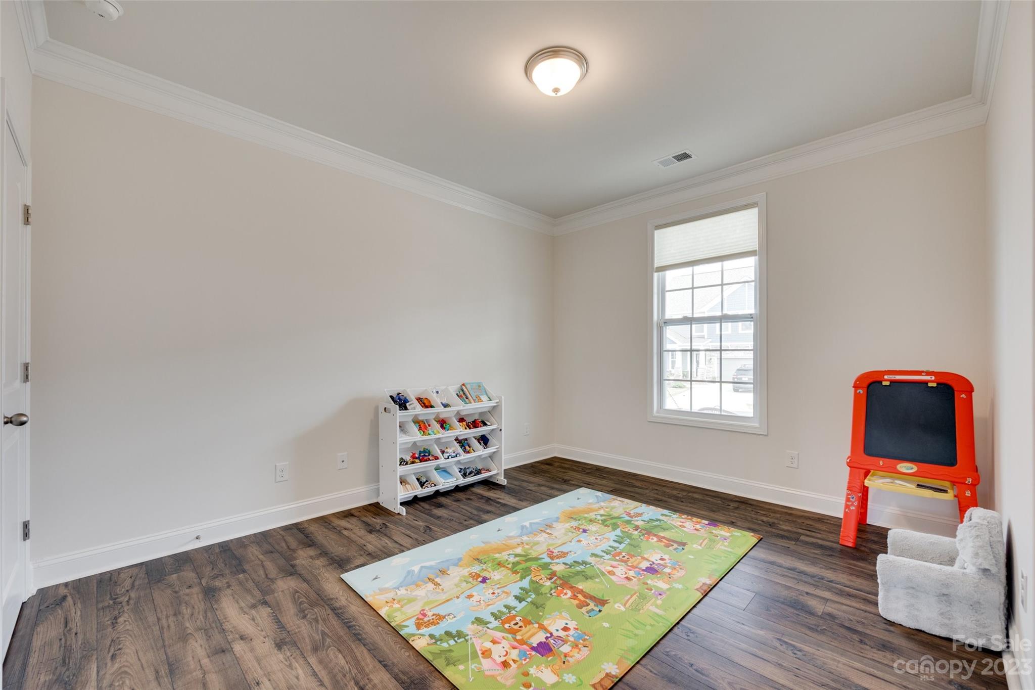 8013 Oakmere Road Waxhaw, NC 28173 - Photo 5 of 30 an empty room with toys and wooden floor